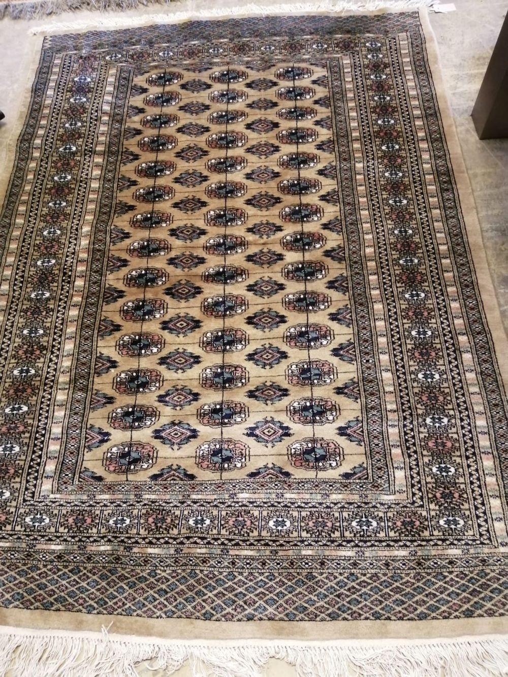 A Bokhara mustard ground rug, 185 x 131cm